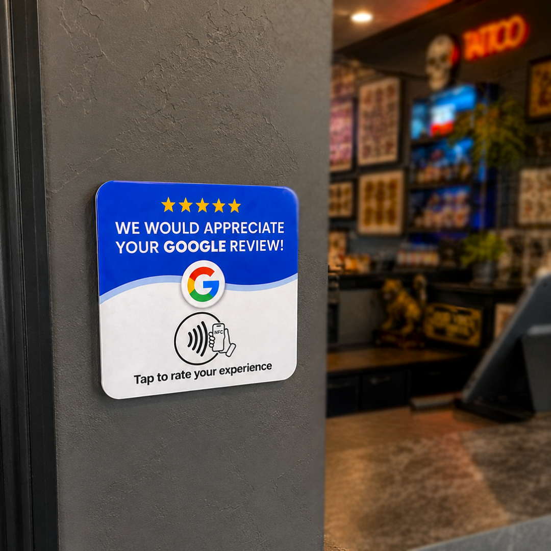 Upside review card on the wall of a tattoo studio