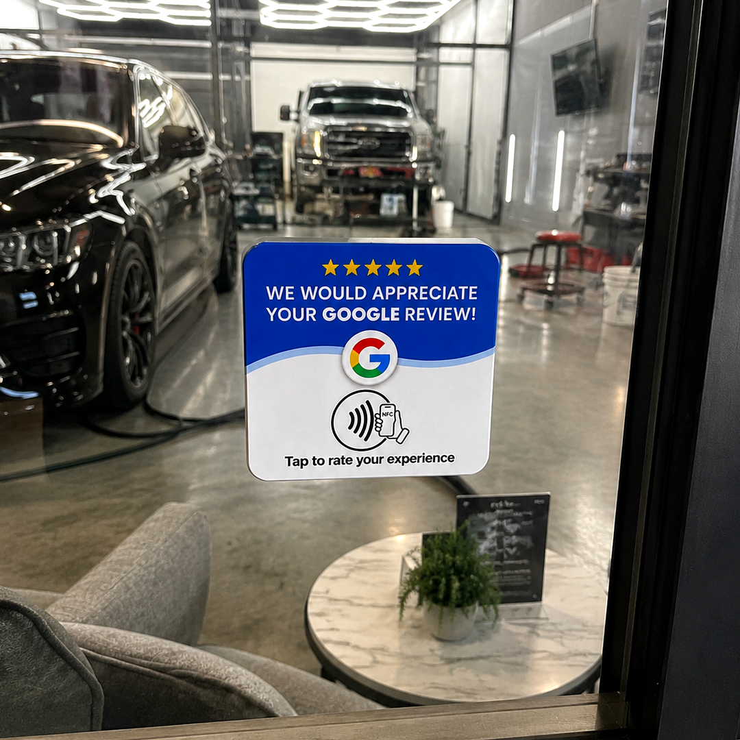 Upside review card on a glass partition in an auto detailing shop